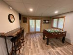 Lower Level Family Room with foosball, TV, fireplace